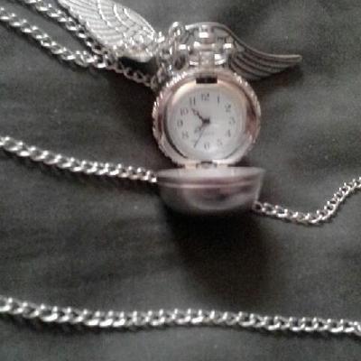 Silver sphere locket with angel wings