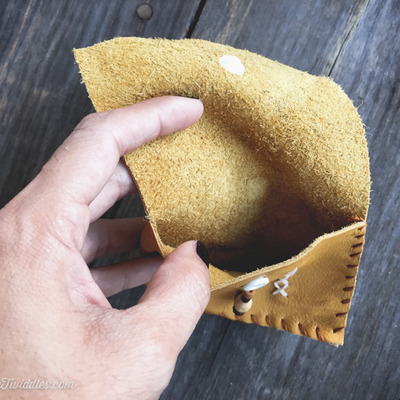 Mustard leather with brown beads and stitching