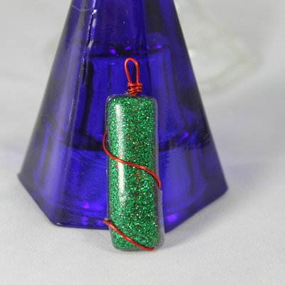 Enchanted column wrapped red ribbon charm 