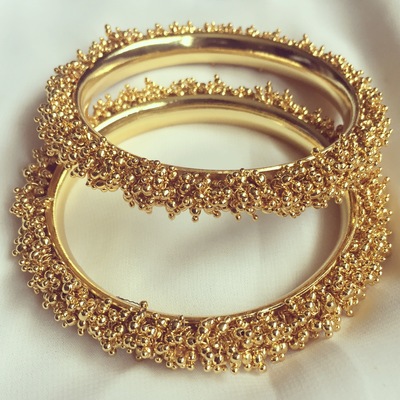 Clustered gold bangles