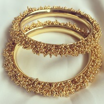 Clustered Gold bangles
