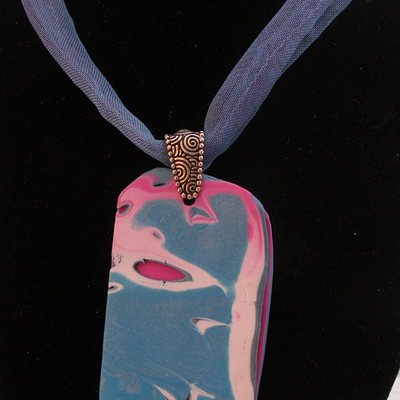 Layered teal polymer clay pendant