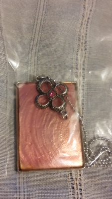 pink mother of pearl necklace with silver flower with pink stone