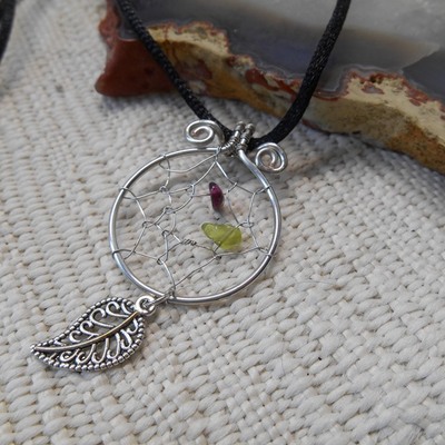 Silver dream-catcher with garnet and peridot