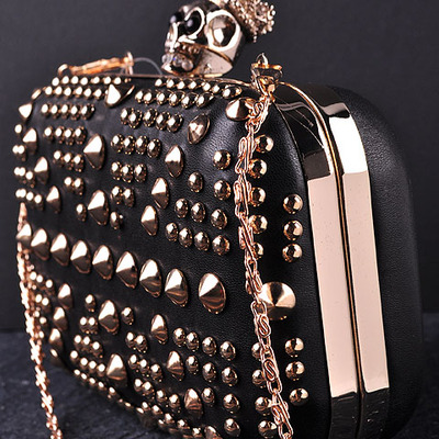  mcqueen inspired britannia gold studded skull clutch   