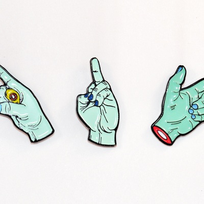 The idle hands enamel pin set