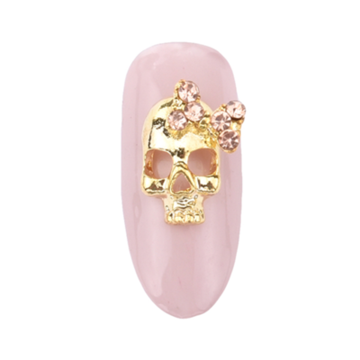 Skull w/ pink bow- gold