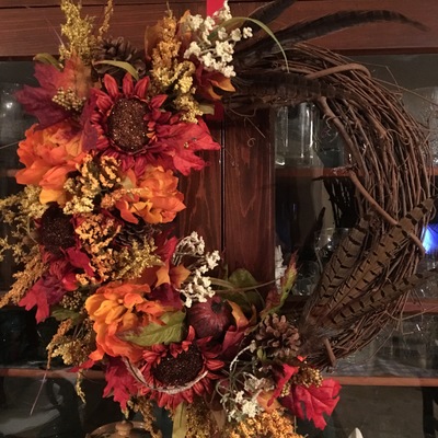 Autumn flowers and feathers