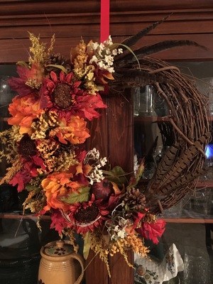 Autumn flowers and feathers