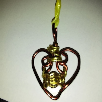 Brown, gold, copper twisted heart necklace