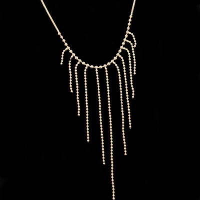 Silver necklace with linear strings with beads 17"