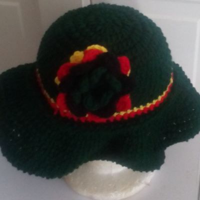 Crochet wider brimmed hat with a flower, purse and earrings