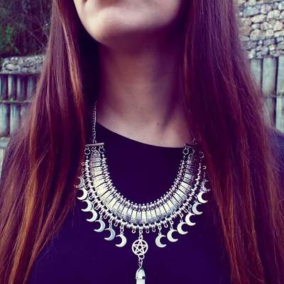 Statement crystal point necklace with moon pendants and a pentagram