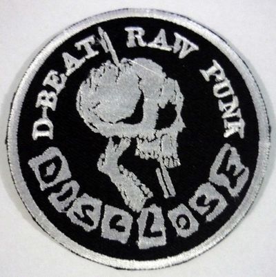 DISCLOSE embroidered circle patch (white border)