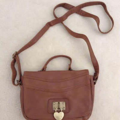 Brown crossbody bag with gold heart locket 