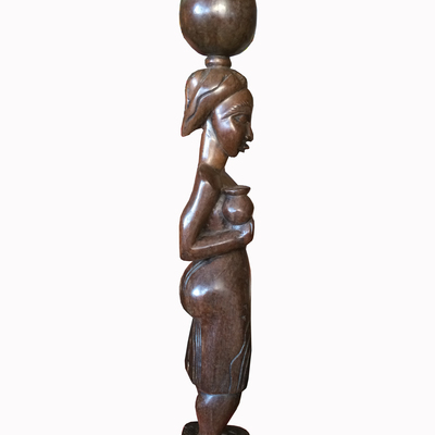 Hand carved african woman carrying earthen pot, traditional ghanaian sculpture  