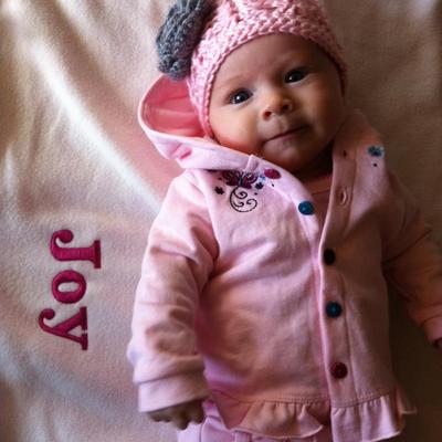 Pink lace stitch beanie with gray flower