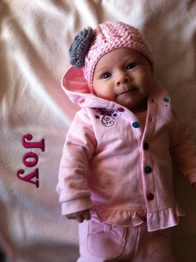 Pink lace stitch beanie with gray flower