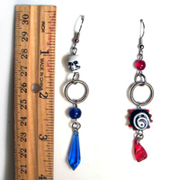 Mismatched Pirate skull earrings in red and blue - Thumbnail 2