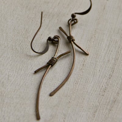 Tied together copper earrings