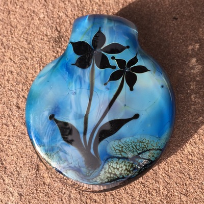 Double-sided floral pendant in struck blue