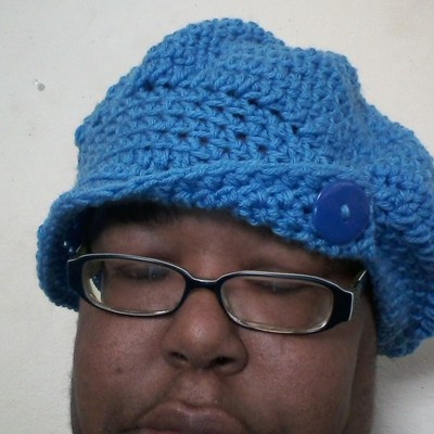 Crochet hat with brim and buttons