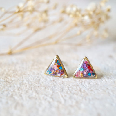 Real pressed flower and resin stud earrings in reds, oranges, blues, purples, and pinks mix