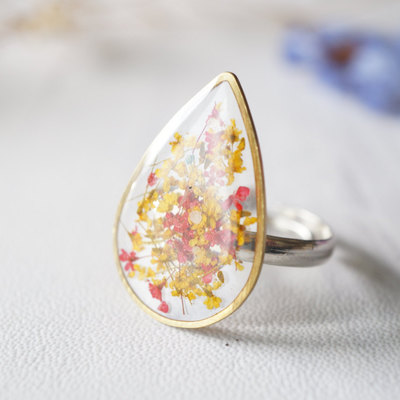 Real pressed flower and resin ring in reds and yellows mix