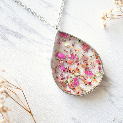 Real dried flowers and resin necklace silver teardrop in pinks, orange, green, pink foil