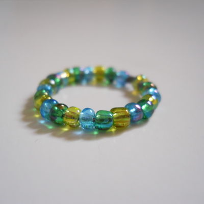 Blue, green and yellow bead ring