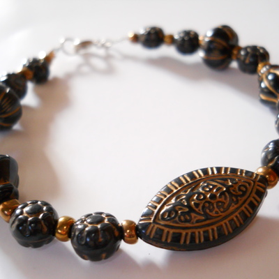 Golden and black oval bead bracelet