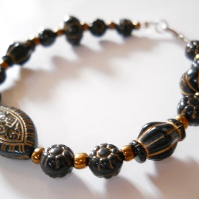 Golden and black oval bead bracelet