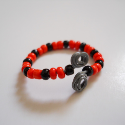 Black and tangerine wire bead ring