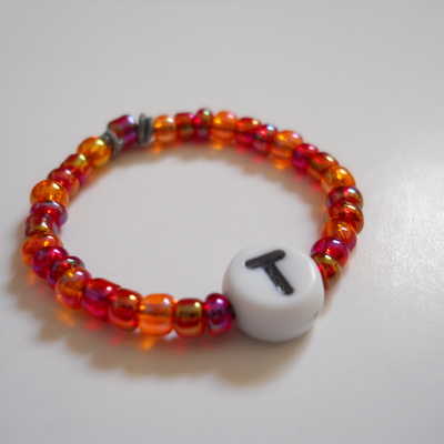 Letter t bead ring