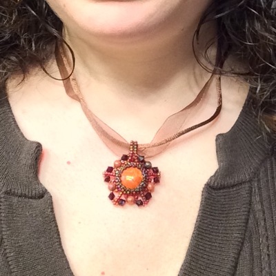 January red jasper pendant with garnet color crystals