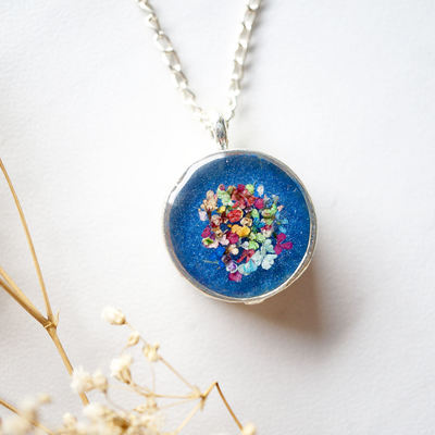 Real dried flowers in resin necklace, thick silver circle in blue party mix