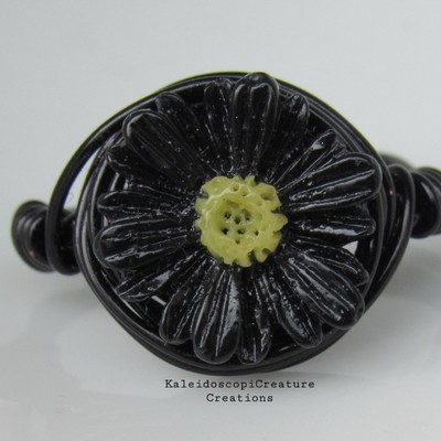 Black on black daisy ring
