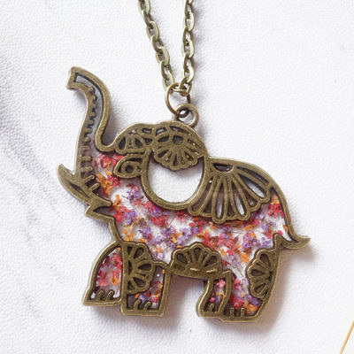 Real dried flowers in resin tribal elephant necklace in pink purple orange