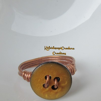 Yellow golden button ring