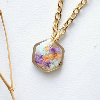 Real dried flowers in resin necklace, small gold hexagon in purples oranges and mint