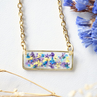 Real dried flowers and resin necklace, gold bar in purple yellow blue