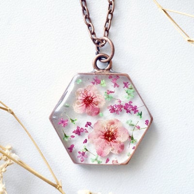 Real dried flowers in resin necklace, copper hexagon in pinks and green