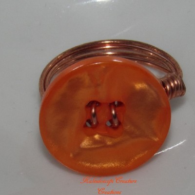 Orange button ring