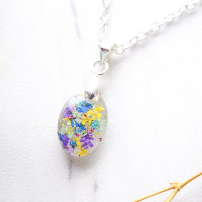 Real dried flowers in oval resin necklace in blue mint yellow purple