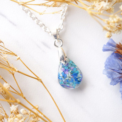 Real dried flowers in teardrop resin necklace in blue mint teal purple
