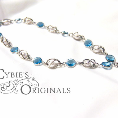 Eye of ra white pearl and light blue necklace
