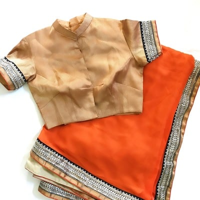 Orange & gold sari with high collar blouse