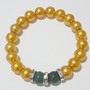 Gold Beaded Bracelet with Green Accent