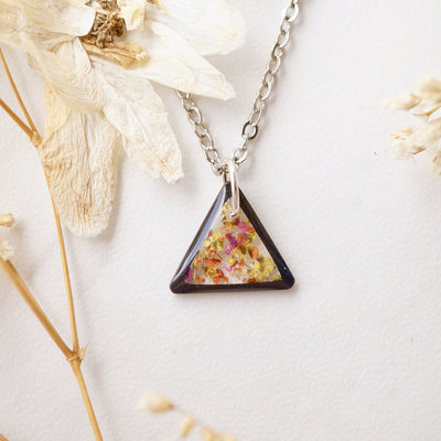 Real dried flowers in resin necklace, small black triangle in red orange yellow