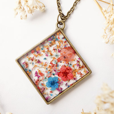 Real pressed flower and resin necklace in red pink orange blue mix